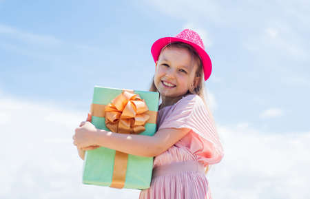 Nice purchase. being excited and surprised to get birthday present. Smiling funny child. Happy child hold shopping gift. cyber monday sale. Kids shopping. cheerful little shopaholicの写真素材