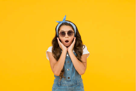 Surprised little girl in fashionable sunglasses, summer sale concept