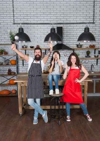 Happy family cooking holiday meals together, having fun concept