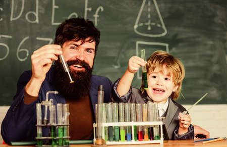 father and son at school. Back to school. researcher carrying out scientific research in lab....