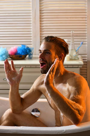 Man with beard and excited face gesturingの写真素材