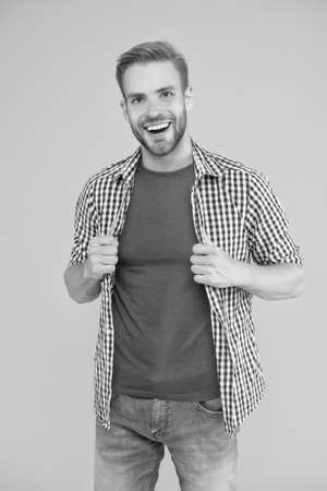 Smile is always in fashion. Happy man smile yellow background. Unshaven guy with healthy smile. Dentistry. Dental clinic. Tooth health. Teeth hygiene. Give me a big smileの写真素材