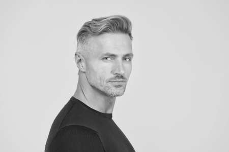 Trendy short haircut. Middle aged man with stylish hair. Hair salon. Mature model in casual style. Barbershop. Barber shop. Mens grooming habit. Hair care routine. Haircare. Because its your hairの写真素材
