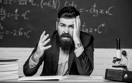 Fatigue or fatigable work. Tired teacher feel fatigue at lesson. Bearded man stressed at school....