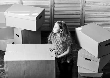 Box package and storage. Kid girl relocating boxes background. Relocating concept. Delivery service....