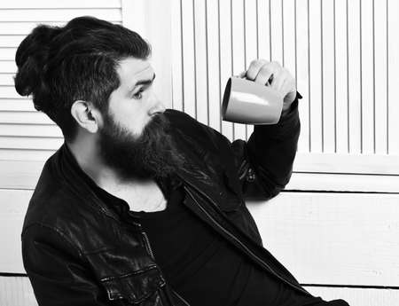 Brutal caucasian hipster holding cup or mugの写真素材