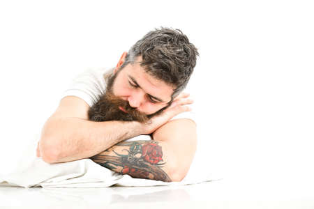 Man with beard and mustache in deep sleep, white background.の写真素材