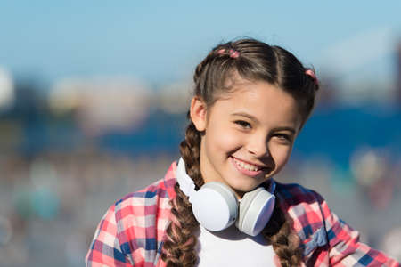Little child using technology for listening music. Small girl with stereo headphones. Music educationの写真素材