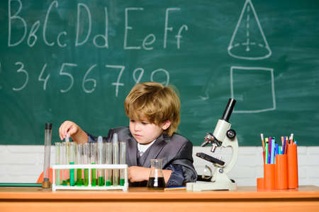 microscope at lab. student do science experiment with microscope in lab. Back to school. Pupil...