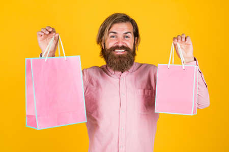 Own business. surprised man unpacking. the package delivery. human emotion and facial expression. bearded man gift holiday decoration. businessman holding gift pack. gift to colleague at workの写真素材