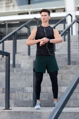 Staying fit and healthy. checking GPS position. performance or heart rate pulse and training working out. Using Smart Watch Outdoors. GPS position concept. heart rate pulseの写真素材