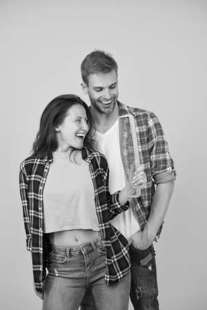 Change hairdo. Hair care at home. Helping with hairstyle. Couple having fun with big comb. Combing and brushing hair. Man and woman taking care hair themselves. Hairdresser services. Creative moodの写真素材