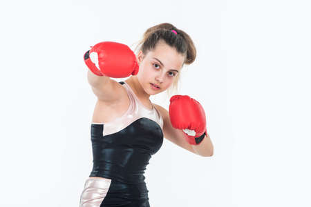 small girl training in boxing gloves. sport and fitness. teen girl boxer. sportswear and equipment...