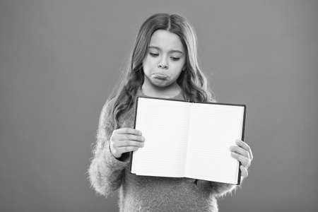 home schooling. Kid fashion. childrens day. Portrait of happy little child. childhood happiness. Happy little girl with long hair. Small girl child. Hairdresser for kids. Looking for inspirationの写真素材