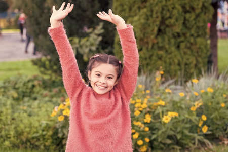 On the weekends I do fun. Girl child have some fun in autumn. Happy girl on autumn landscape. Small girl happy smiling. it is getting autumnの写真素材
