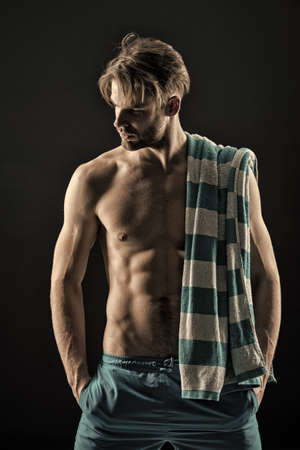 Spa man with towel, hygiene after training. Spa model with with fit bare chest and belly muscles, health, vintageの写真素材