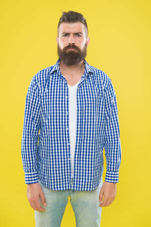 Mature upset man. Male fashion and spring style. Brutal bearded hipster in checkered shirt. Summer hipster. sad man with beard on yellow background. brutal man feel upset. sad and hopeless guyの写真素材