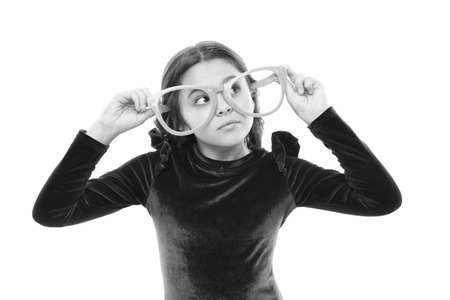 Girl kid wear big eyeglasses. Eyesight and health. Optics and eyesight treatment. Effective exercise...