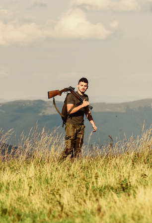 for better tomorrow. soldier in field. polygon. muscular man hold weapon. purpose and success. man...