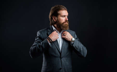 business man wear suit. official office lifestyle. serious bearded man. handsome man in expensive suit. shirt with hand watch. stylish successful man in suit posing. tuxedo fashion lookの写真素材