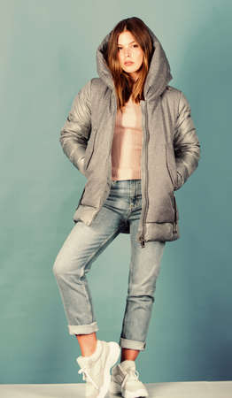 Lost in thoughts. happy winter holidays. beauty in winter clothing. cold season shopping. flu and cold. seasonal fashion. woman in padded warm coat. girl in puffed coat. faux fur fashionの写真素材