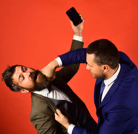 Business talk and rivalry concept. Men with beards fightの写真素材