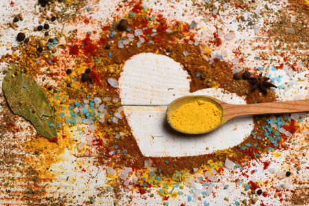 Set of spices on white wooden background. Composition of condimentの写真素材