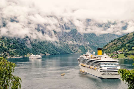 Cruiser ship in fjord, Norway.Luxury cruise ship at norwegian fjords.の写真素材