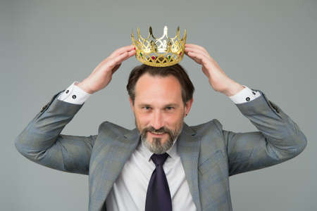 Winner handsome man actor artist scientist with crown, respectful person conceptの写真素材