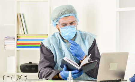 Doctor studying. Coronavirus outbreak. Latest scientific findings and knowledge on coronavirus...
