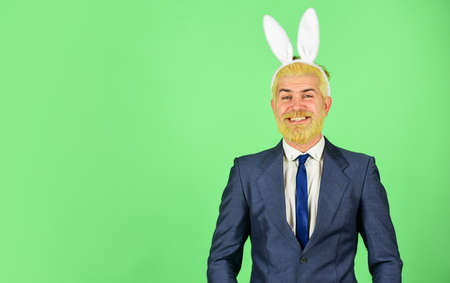 Happy Easter. Happy businessman wear rabbit ears. Bearded man celebrate Easter. Easter celebration. Spring holidays. Easter bunny is here, copy spaceの写真素材