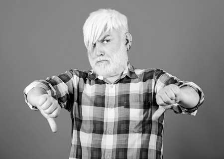 Subculture attributes. Emo subculture. Senior man with long bangs and beard. Mature hipster unusual...