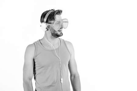 Guy unshaven face listening summer music.の写真素材