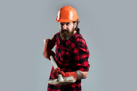 He needs a little break. confident construction engineer. professional architect hold shovel in...
