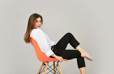 Fashion model looking casual. Stay home. Summer makeup. Girl sit on chair. Girl with natural makeup....