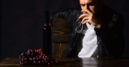 Winetasting and degustation concept. Man with beard drinks wine glassの写真素材