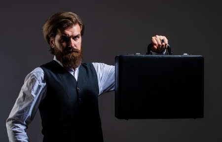 Businessman hipster man formal suit show briefcase in darkness, male fashion conceptの写真素材
