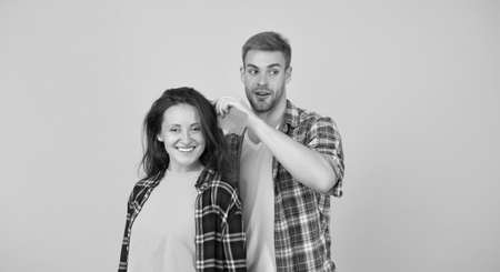 Combing and brushing hair. Man and woman taking care hair themselves. Hairdresser services. Creative...