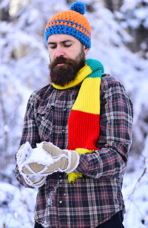 Guy with concentrated face with forest covered by snow.