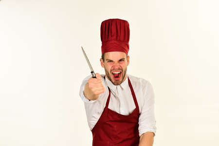 Cook works in kitchen. Chef with mad yelling faceの写真素材
