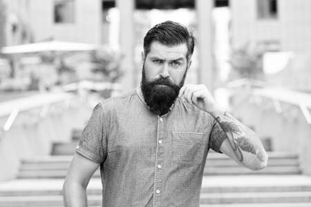 Bearded man. Confident brutal man walk street. Male barber care. Male fashion. Guy with beard and...