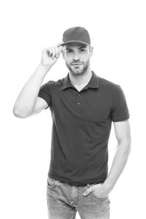 Ready to serve you. Man delivery service. Guy in red cap isolated on white background. Express courier service. Shipping and delivery service. Post worker. Help with relocation and move outの写真素材