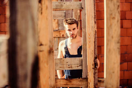 Planning a new construction. man builder in work clothes. professional repairman hard hat. engineer...