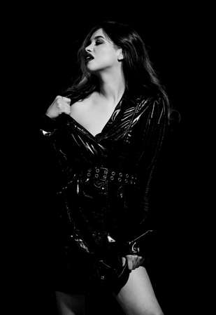 Mysterious passionate fashion model in leather cloak.の写真素材