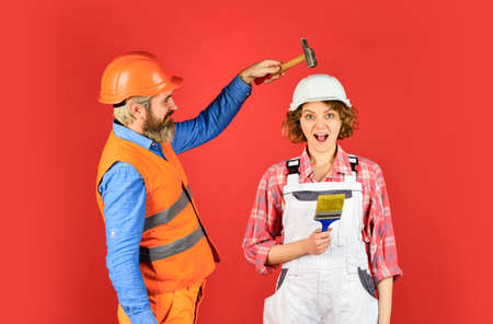 save your head. new house construction concept. Portrait of family wearing hardhat. Construction...