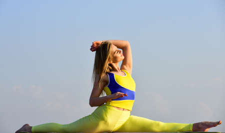 woman sit in split. flexible girl in sportswear. Young attractive woman practicing yoga. Splits exercise. leg muscles stretching workout for gymnastic split. Beautiful Woman With Sexy Fit Bodyの写真素材