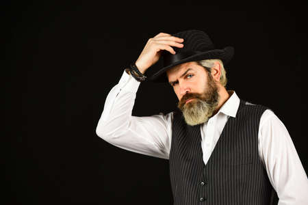 man in vintage style wide brimmed hat. Man with retro Hat. brutal bearded hipster in suit vest....