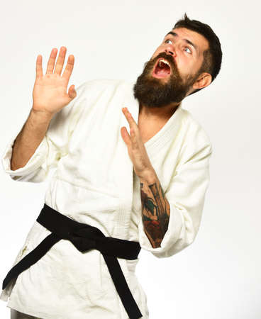 Man with beard in white kimono on white background.の写真素材