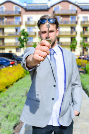 Man in suit with tie or businessman with serious face