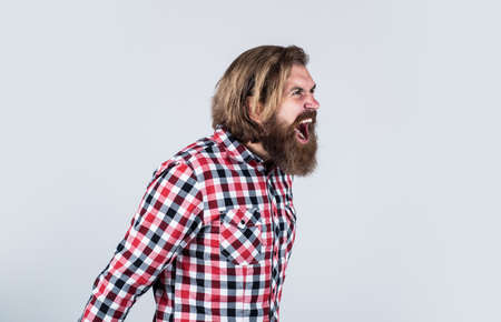 feel huge anger. angry bearded man in checkered shirt shouting. Portrait of bearded hipster. guy...